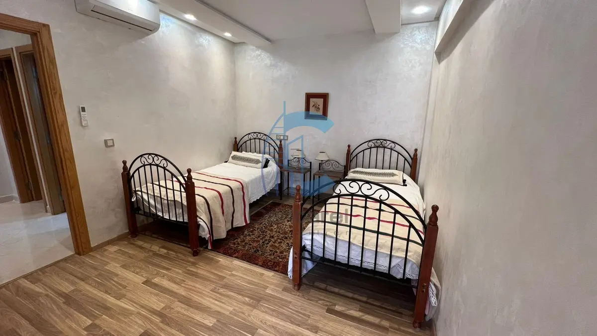 RENOVATED FURNISHED 2-BEDROOM APARTMENT WITH BALCONY AND POOL VIEW FOR RENT - SEMLALIA MARRAKECH - detail.photo 2